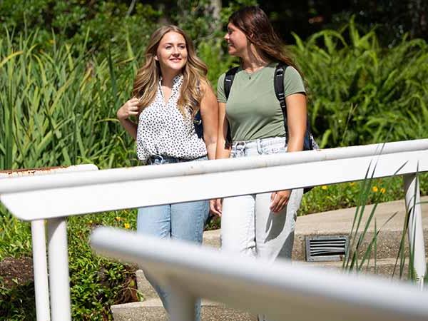 two students walking on the pensacola campus